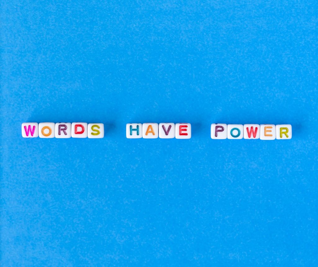 Words have power, flatlay on blue background
